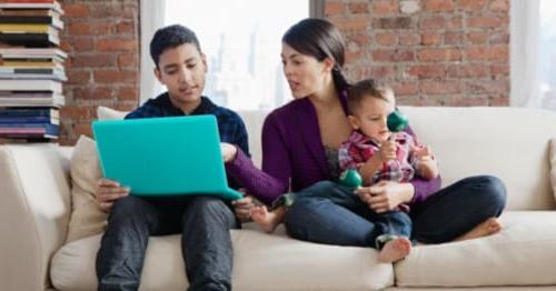 A student and parent learning how to transfer to online high school. 